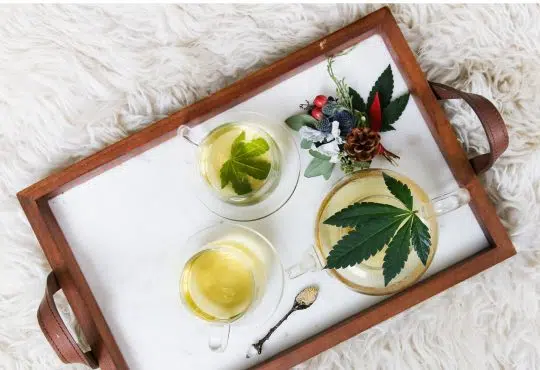 rectangular brown wooden tray filled with tea